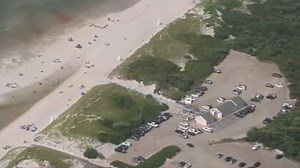 Mayflower Beach lifeguards rescued woman and two girls from rough surf Thursday