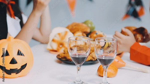 Joyful office Halloween party with coworkers in costumes, celebrating with drinks and laughter, fostering teamwork and festive spirit