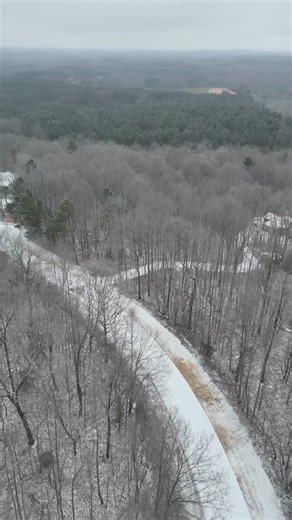 Aerial view of a icy snow-covered Chatham County road - 1.25.26 Experience the quiet beauty of a snowy Chatham County, North Carolina landscape in this cinematic drone video. Watch as the drone captures the winding road through the woods, offering a serene nature escape. Music by Bensound Artist: Benjamin Lazzarus License code: JGZQI9LE29UCJY6O | Chatham Journal Newspaper