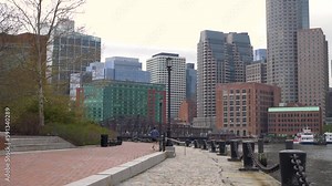 Boston skyline from Harborwalk Fan Pier Park in slow motion on a cool fall day by the water