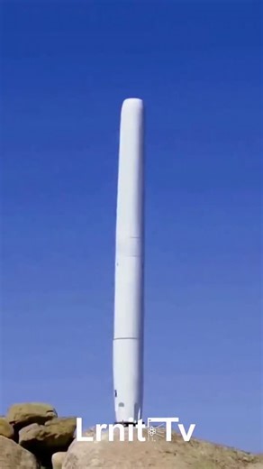 lrnit on Instagram: "​It looks like a giant wobbly stick, but it’s actually generating power. 🌬️⚡ ​You are watching a Vortex Bladeless turbine. Unlike traditional windmills that spin, this one vibrates to create electricity. Here is the science: ​1️⃣ The "Vortex Shedding" Effect: When wind hits a cylindrical object (like a chimney or this pole), the air swirls around it and creates little whirlpools (vortices) on alternating sides. ​Normally: Engineers try to stop this because it shakes buildin