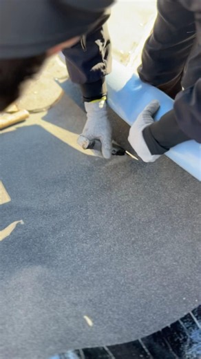 Watch this roofer slice through ice and water shield! 😳 #roofing #construction