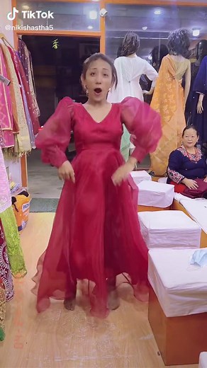 Elegant Twirling Dress Showcase in a Clothing Store