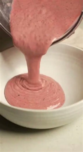chef preparing a vibrant smoothie bowl