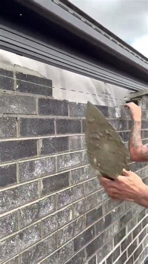 the process of installing red bricks in construction