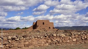 Pecos National Historic Park in New Mexico. Pecos Pueblo Mission Church Mission Nuestra Señora de los Ángeles de Porciúncula de los Pecos, a Spanish mission near the pueblo. Fast moving clouds.