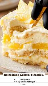 Refreshing Lemon Tiramisu: A sunny, citrusy twist on the Italian classic! 🍋🇮🇹 Instead of coffee and cocoa, this dessert features ladyfingers soaked in a zesty limoncello syrup, layered with a rich mascarpone cream and swirls of bright yellow lemon curd. It’s light, creamy, and the perfect no-bake dessert for spring and summer. #LemonTiramisu #LemonDessert #ItalianDessert #NoBakeRecipe #Limoncello #SummerDessert #MascarponeCheese #LemonCurd #TiramisuTwist #CitrusLover #Ladyfingers #FancyDesser