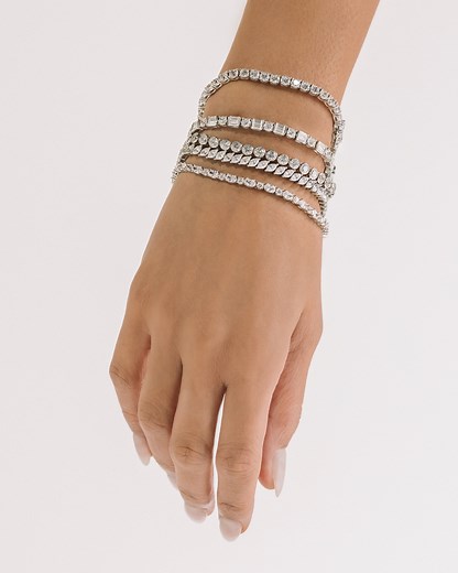 3K views | Dripping in sparkles and history  The tennis bracelet trend originated at the 1987 U.S. Open when professional tennis player Chris Evert requested a pause for play so she could look for her jewels and we've been gushing over it's existence since. Stay tuned because we're dropping a new design later this month to take your jewellery style to match point  Check out our tennis bracelet collection here  https://shorturl.at/chKTX | Secrets | Facebook