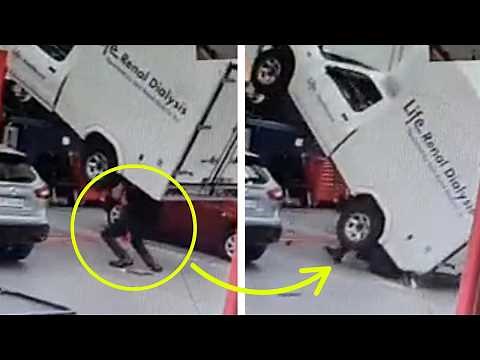 CAR FALLS FROM A LIFT ON A WORKER