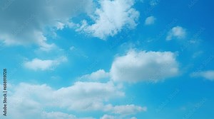 4K : Blue sky time lapse - The azure canvas transforms swiftly as fluffy clouds dance across the cerulean sky, a mesmerizing ballet of nature in fast timelapse. Summer sky background. HDR.