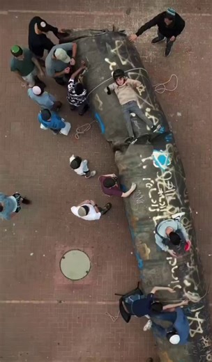 Did I tell you this country is NUTS? A HUGE debris fell in the high street near my home, the one wjth the florist, the bakeries, the good butcher... the one always jammed on Friday mornings.Everyone was protected, and barely a window exploded. Miracle? Perhaps.But there's a big crater in the street. So it's closed and tractors are repairing the asphalt.The conversation on the street goes like. "Ok, there was a missile. They REALLY need three hours to repair it?I got shabbat shopping to do, me".W