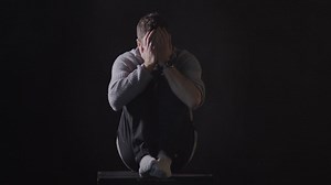 Mental illness concept background, Depressed Man having mental breakdown, swings back and forth in dark room | Premium Stock Video Footage