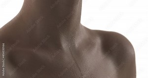 Sweat drops are dripping on chest of unrecognizable Caucasian woman. Close up of wet skin on neckline and collarbones zones. Heavy breathing. Isolated on white background