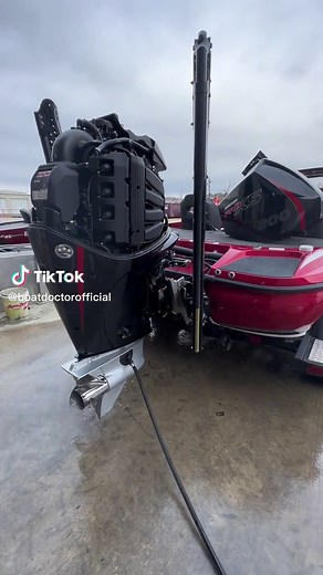 Powerful 500HP Outboard Motor on Sleek Red Boat