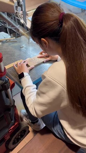Woodworking Techniques: Young Woman Carving Wood in Workshop