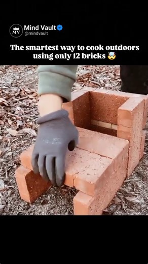 Mind Vault on Instagram: "This video demonstrates the quick assembly of a DIY rocket stove using standard red bricks. Set in an outdoor wooded environment, a pair of gloved hands efficiently stacks the bricks in a specific, mortar-free configuration to create an internal combustion chamber and a chimney.The process is rhythmic and satisfying, showing the precise placement required to ensure airflow. Once the structure is complete, small logs are fed into the base, and a pot is placed on top. The