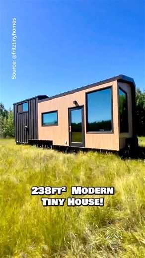 Would you live in this beautiful tiny house on wheels? I'm in love with all of the windows & natural light pouring in! Inside this tiny home, there is a living area & a couch with built-in storage underneath, an L-shaped couch with apartment-size appliances & custom concrete counters, a set of storage stairs leading you up to an ingenius lofted bedroom that allows you to stand next to the closet & bed, & a full bathroom with a beautiful tile shower & washer/dryer combo unit! Built by the talente