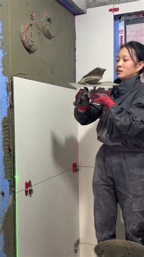 Installing large wall tiles with precision and care