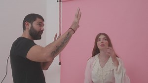 Photographer directing a model during a photoshoot - Free Stock Video