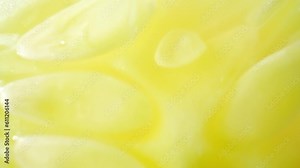 Macro video showcases a half cucumber in stunning detail, revealing its vibrant green skin, delicate ridges, and glistening droplets of moisture. Fruit and vegetable concept. Cucumber background. 4K