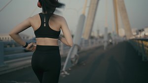 Download fit young woman running athlete sprinting fast running intense workout challenge training endurance in urban city on morning or evening for free