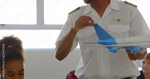 Pilot giving training about model aeroplane to kid 4k