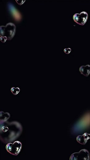 Heart-Shaped Bubbles Against Dark Background