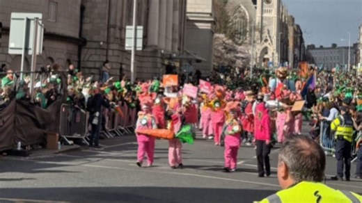 Crowds line the route as Dublin’s St. Patrick’s Day parade moves on