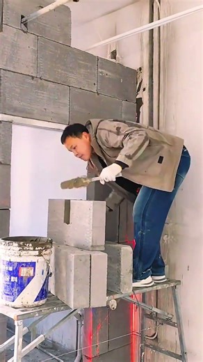 Block trimming and shaping for wall construction.