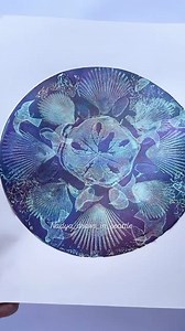 @nadya_draws_in_seattle has created a shell-tacular mandala gel print! The deep purples and blues combined with delicate shell patterns make this piece beautifully unique. 🐚💜💙✨ #gelprinting #gelprintingart #gelliart #gelprintartist #gelprints #mandala #mandalaart #printartist | Go Craft