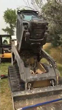 Lifting the cab on a Cat 259D skid steer