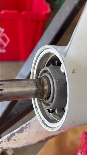 Outboard Motor Lower Unit Gearcase Maintenance - Checking for line around the propeller shaft.