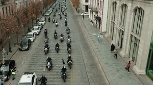 Thousands of bikers rev their engines in a thrilling motorcycle parade, showcasing their helmets and gear at the biker show