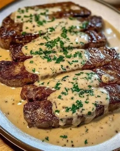 Juicy Steak with Creamy Garlic Sauce Ingredients: - 4 beef steaks (sirloin or ribeye) - 2 tablespoons olive oil - Must express something to keep getting my recipes.... Thank you. Get Full Recipe in First (c.o.m.m.e.n.t ).👇 | Mama's Cooking Recipes