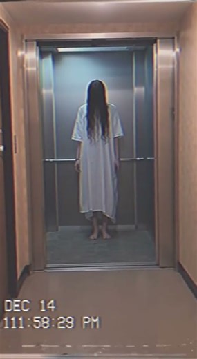 Midnight Elevator Ghost Stands Silent Watching From the Darkness