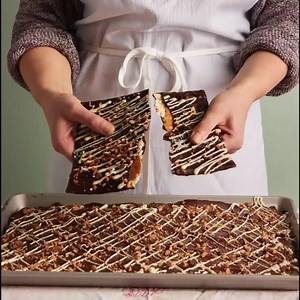 6K views · 146 reactions | It’s that time of the year, Matzo Crunch is here! Layers of Matzo Cracker, topped with handmade butter crunch candy, dark and white chocolate, and toffee pieces. It’s as good as it sounds... Don’t miss out, quantities are super limited! Available in-store and for nationwide shipping at magnoliabakery.com (while supplies last). #magnoliabakery #passover  | Magnolia Bakery | Facebook