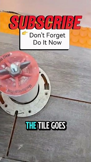 Cut tile around a toilet flange tip. #diy #tiles #toilet