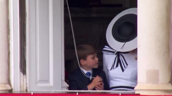 Prince Louis plays with curtains during Trooping the Colour parade