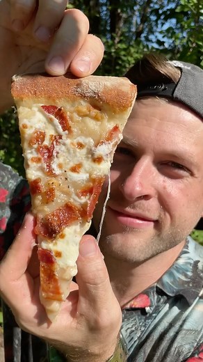 Is this good or gross? 🍕⁉️ Clam Chowder Pizza! ✨ RECIPE ✨ 🔹Hand roll your Pizza Dough out to 16 inches. 🔹Open a can of clam chowder soup and spread it around evenly. 🔹Add a layer of fresh mozzarella cheese and top with a chopped thick cut bacon. 🔹Get your pizza stone to around 650F and cook it for 5 to 6 minutes. 🔹Take it out, slice it up, and enjoy! 🛠️ MY COOL TOOLS 🛠️ 🔥 I used my @halo.pg Pizza Oven to cook this weird pizza. 🪓 I chopped my bacon with my @thecookingguildshop cleaver. 
