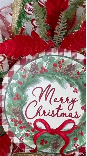 This Merry Christmas wreath with red velvet leaves and a velvet designer ribbon bow adorned with sparkling rhinestones is the perfect way to welcome the holiday season in style. Handmade with premium materials, this festive wreath features a cheerful “Merry Christmas” sign framed by lush greenery, glittering accents, bright red berries, shatterproof ornaments, and elegant wired ribbons. | Dixie's Wreaths | Facebook