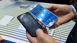 Electronic giants begin settlement talks