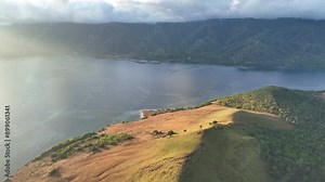 Morning sunlight illuminates the scenic island of Lembata, Indonesia. This beautiful and biodiverse area is part of the famed Ring of Fire and is home to high marine biodiversity.