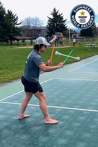 Andrew breaks record for most helicopter spins with devil sticks in one minute