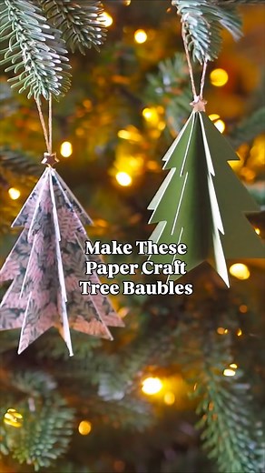 How to make paper craft tree baubles to decorate your home with at Chrismas! Make these nostalgic and whimsical Christmas paper decorations to hang on your Christmas tree. All you will need is some paper card, string, small gold stars (these are from Hobbycraft), a pencil, some scissors, glue and you can download a free tree template on my blog (the link is in my Christmas highlights). #paperdecorations #papercraft #christmascrafts #christmascraftsforkids | Melanie Lissack Interiors
