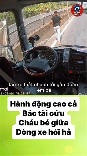 A heartwarming act on the highway: A driver carries a baby across the road amidst heavy traffic.