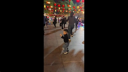 Three-year-old goes viral after effortlessly joining women's dance group and grooving out