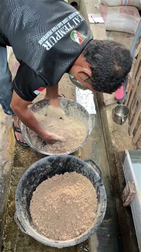 Mixing Duck Food Before Feeding Time at the Farm