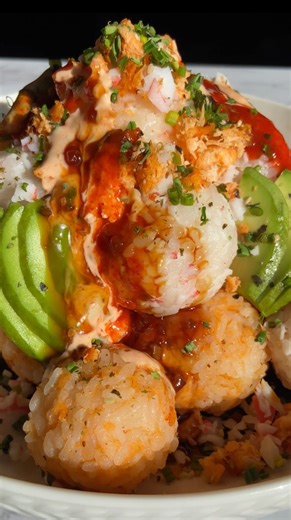 Sushi Ball Volcano 🌋 the most EPIC & flavorful way to enjoy sushi at home. Perfect for a fun appetizer or weeknight dinner! I used my favorite Sticky White Rice from @EatInnovAsian sticky white rice. It’s a staple in our home for rice bowls, onigiri, sushi & so much more. Heat the sticky white rice in the microwave for 5 minutes. Then mix with cooked minced shrimp, salmon & surimi. Shape the rice balls with your hands & then stack to form your volcano. Details below! •chives •avocado •furikake 