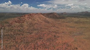 An aerial view of the rugged mountain ranges of the MacDonnell Ranges situated in the Northern Territory, Australia