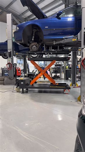 Making use of our lifting table, the S62 V8 engine and Getrag 420g six speed manual transmission being lowered out of its E39 M5 home in preparation for an engine rebuild. #bmwm5 #e39m5 #bmwspecialist #bmwworkshop #bmrperformance | BMR Performance